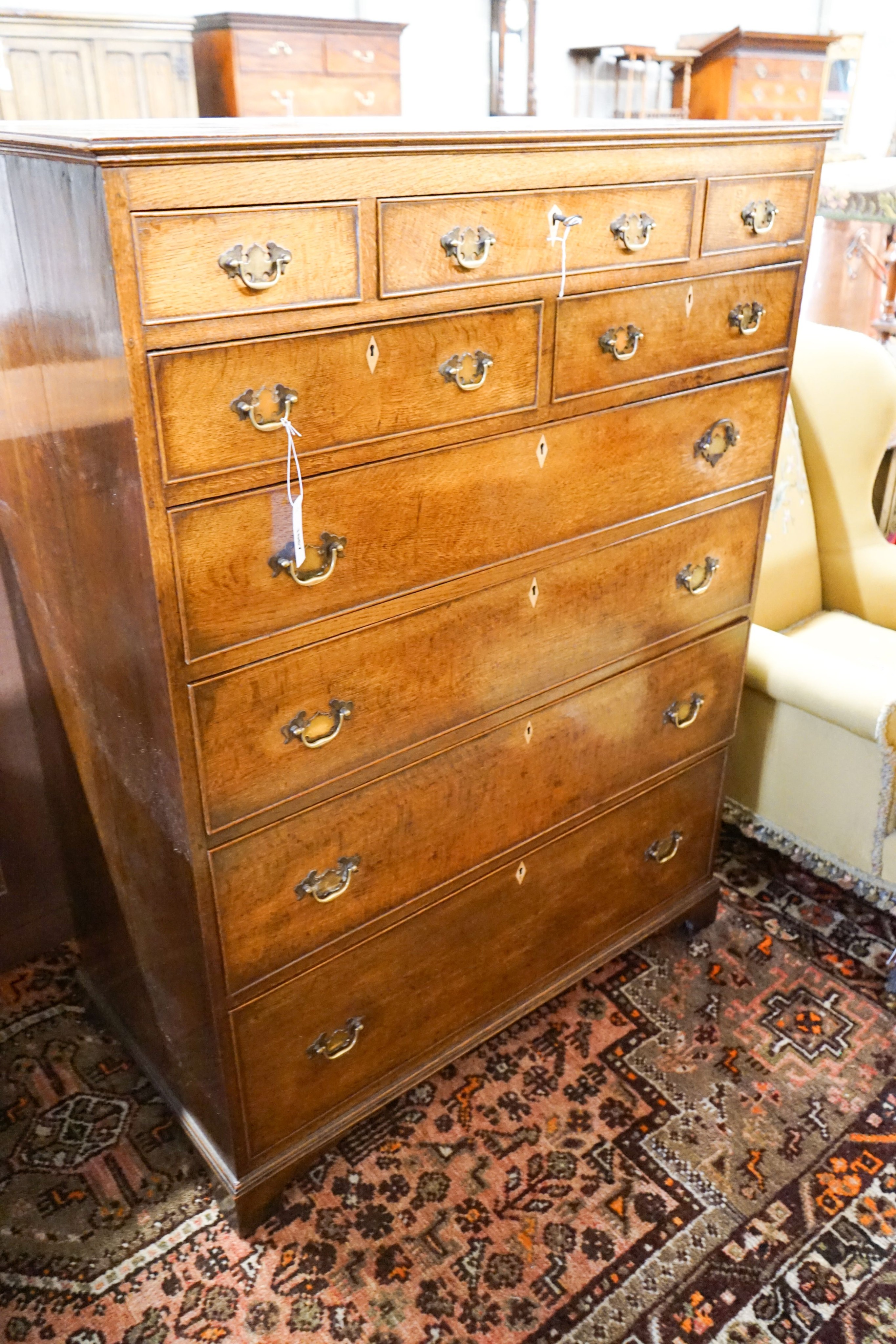 A George IV tall oak chest of drawers, width 107cm, depth 54cm, height 141cm